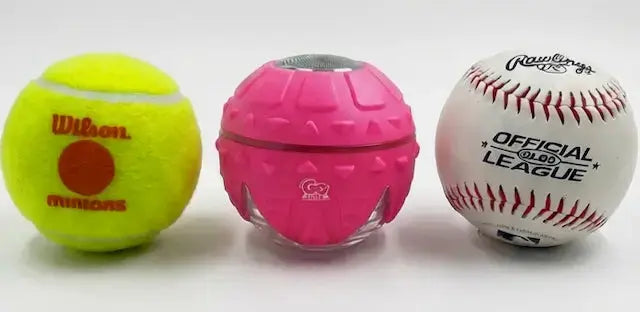 Three balls including a tennis ball, a pink personal trimmer, and a baseball.